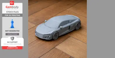 3D-printed Audi R8 scale model on wooden floor, detailed car design.
