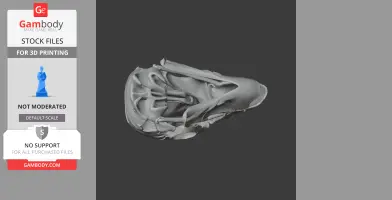 A detailed 3D-printed replica of a stylized skull with intricate, abstract features.