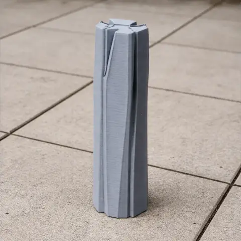 A 3D-printed model of a modern, tall skyscraper with sleek, angular design elements.