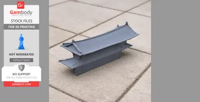 3D printed model of traditional Korean building, featuring curved roof, placed on tiled surface.