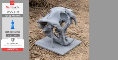 A detailed 3D-printed leopard skull replica on a stand, displayed on a sandy ground.