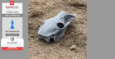 A 3D-printed llama skull replica on textured dirt, showcasing detailed bone structures.