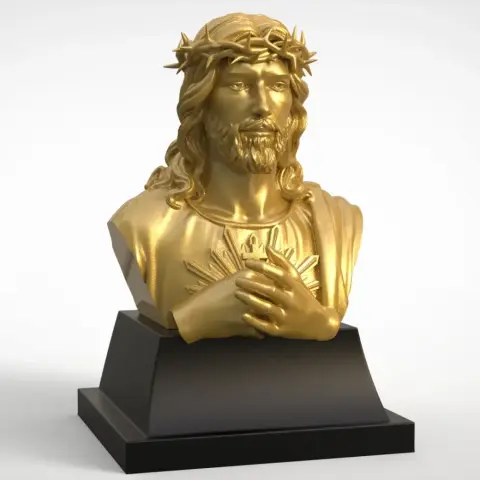 Golden bust of Jesus with a crown of thorns on a black pedestal.