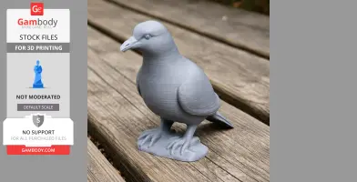 A 3D-printed model of a pigeon, gray in color, displayed on a wooden surface.