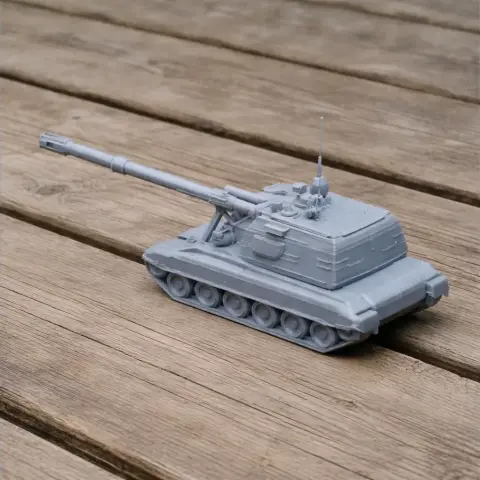 A detailed 3D-printed model of a 2S19 Msta tank with a long barrel on a wooden surface.