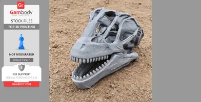 3D printed dinosaur skull model on a dirt surface, showing detailed teeth and bone structure.