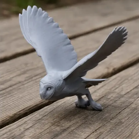 3D printed model of a barn owl with wings spread, poised as if in mid-flight.