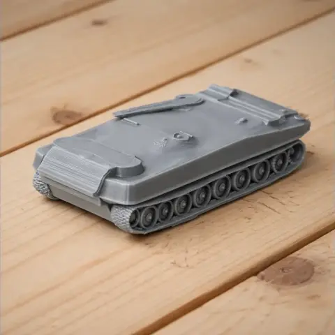 Gray 3D-printed model of a tank with a flat top and detailed tracks, displayed on a wooden surface.