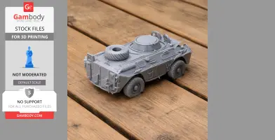 A 3D printed model of a tank on a wooden surface, featuring intricate details and a spare tire.