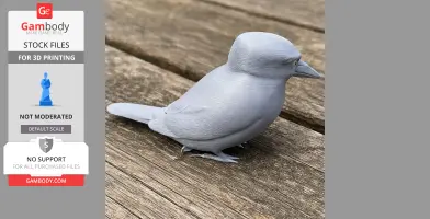 Gray 3D-printed model of a small bird, resembling a kingfisher, sitting on a wooden surface.