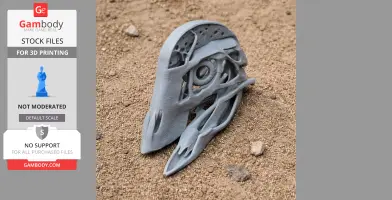 A detailed, intricate 3D-printed skull replica with large eye socket and smooth surface on sandy ground.