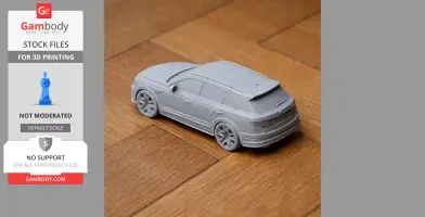 A 3D-printed scale model of a Bentley Bentayga on a wooden floor.
