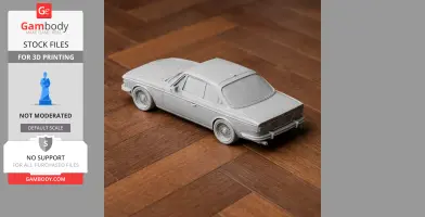 3D printed model of a BMW E9 car on a wooden surface, showcasing intricate design details.