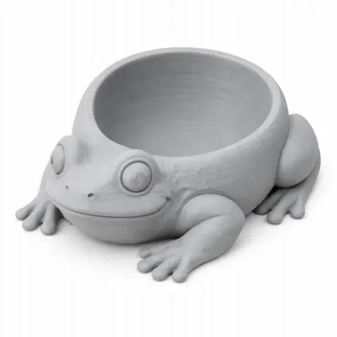 A 3D-printed toad-shaped bowl with the body forming the container and the head and legs as decorative elements.
