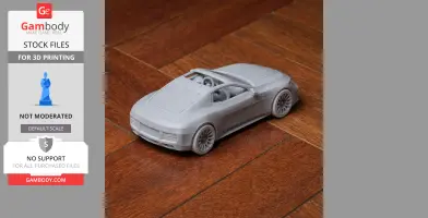 3D-printed scale model of a car on wooden floor, showcasing intricate design detail.
