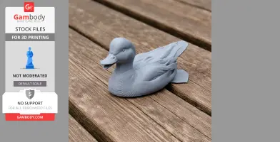 3D-printed American wigeon model, gray, placed on a wooden surface.