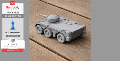 3D printed model of a wheeled tank on a wooden surface.