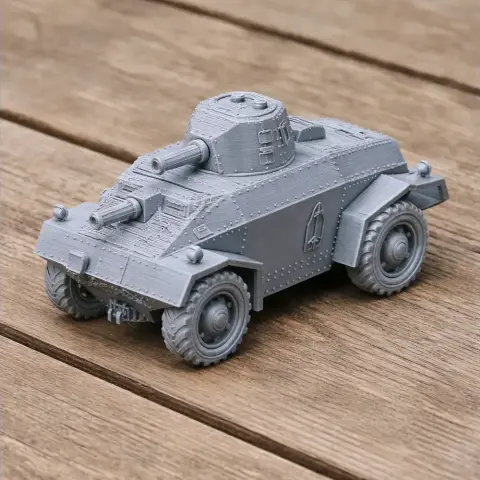 Gray 3D-printed model of an armored vehicle with turret, placed on a wooden surface.