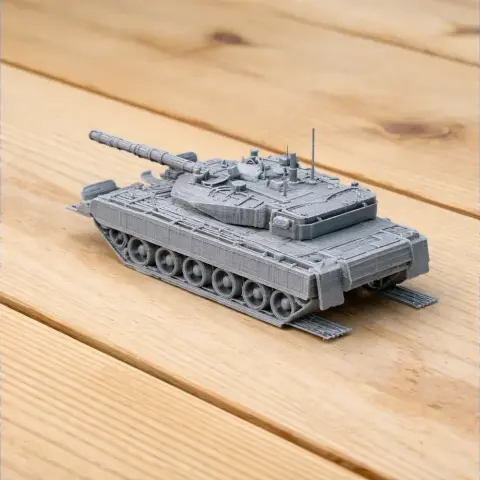 Gray 3D-printed model of an Arjun MBT tank on a wooden surface.