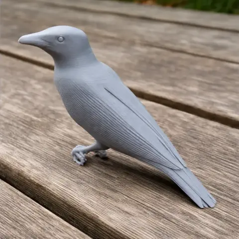 Gray, detailed 3D print of a bird, perched on a wooden surface.