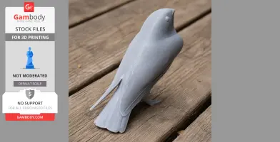 Gray 3D-printed bird model on wooden surface, resembling an andaman nightjar in a standing pose.