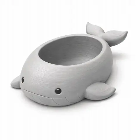 Cute whale-shaped bowl with a smiling face, fins, and tail, designed as a wall hook.