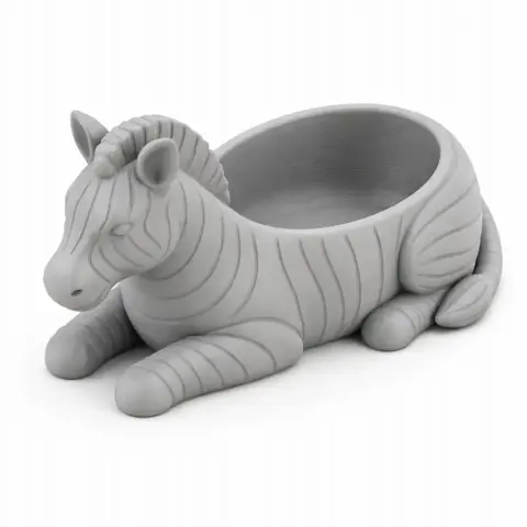 A zebra-shaped bowl with striped design, lying down, intended for 3D printing.