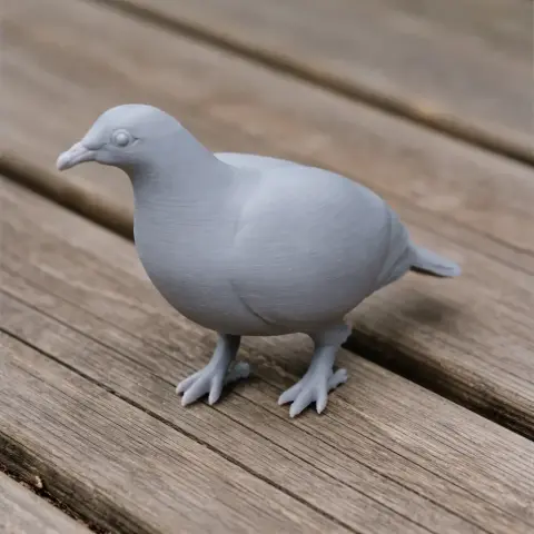 Gray 3D-printed model of an Andaman wood pigeon on a wooden surface.