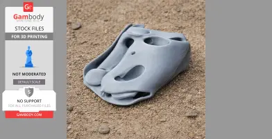 Gray Balaur dinosaur skull replica on textured sand background.