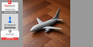 Gray 3D-printed model of a Boeing 737 airplane on a wooden surface.