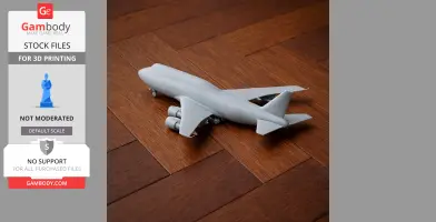 Gray 3D-printed Boeing 747 model on a wooden surface.
