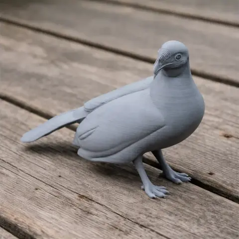3D-printed model of an Andean guan bird in gray, standing on a wooden surface.