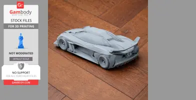 3D-printed model of a Bugatti Bolide on wooden floor, showcasing detailed car design.