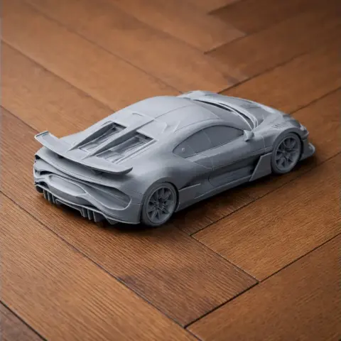 3D printed model of a Bugatti Divo car on a wooden surface.