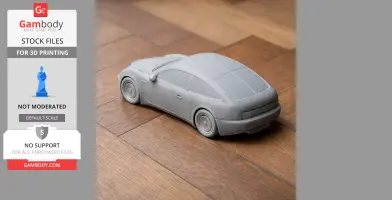 3D printed model of a Bugatti EB 112 car on a wooden surface.