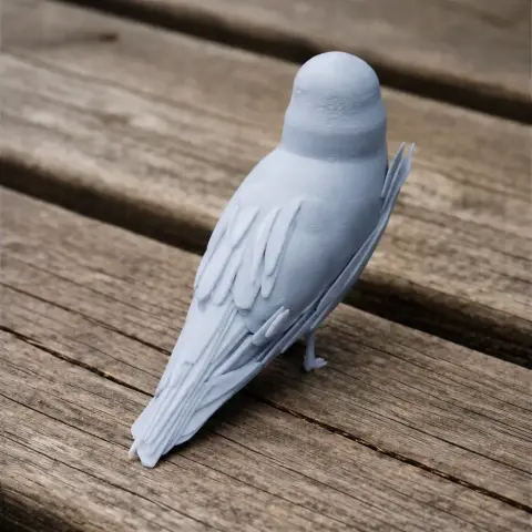 A 3D printed model of an Andean gull, detailed and gray, perched on a wooden surface.