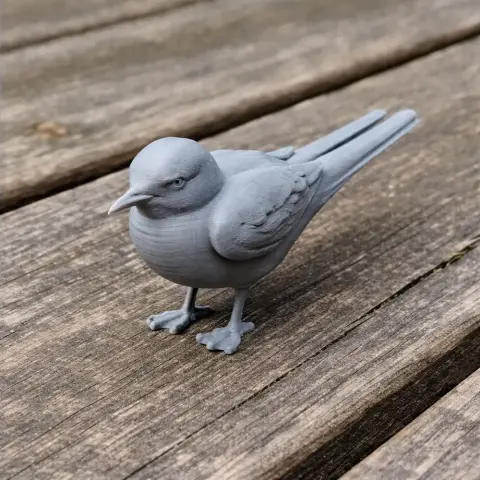 Gray 3D-printed model of an Antarctic tern bird on a wooden surface.