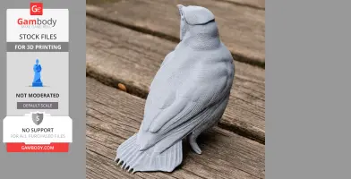 A gray 3D-printed bird model, detailed with textured feathers, sits on a wooden surface.