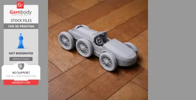 Gray 3D-printed Bugatti Type 35 model on wooden floor, showcasing intricate wheel and body details.