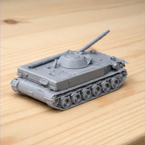Gray 3D-printed model of a BMP-3 tank with detailed turret and tracks, placed on a wooden surface.