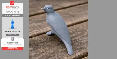A gray 3D-printed model of a bird, standing on a wooden surface.