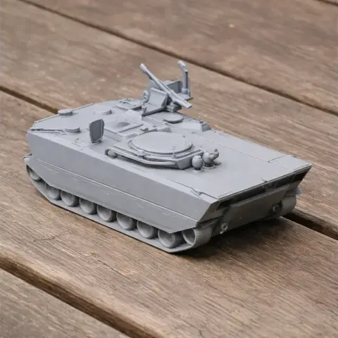 Gray 3D-printed model of a Borsuk infantry fighting vehicle on a wooden surface.