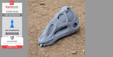 A 3D-printed Galesaurus skull replica, gray, on a textured soil surface.