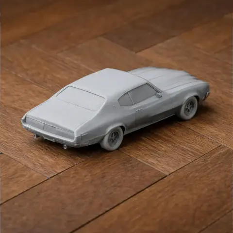 3D-printed model of a classic Buick Skylark on a wooden surface.