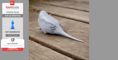 A 3D printed model of a prehistoric bird with detailed feathers, sitting on a wooden surface.