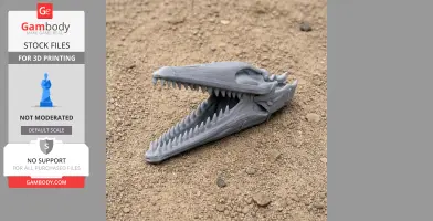 3D-printed Hironosaurus skull replica with sharp teeth, displayed on a sandy surface.