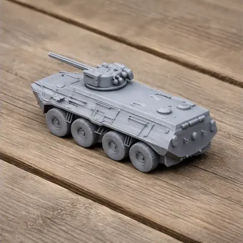 Gray BTR-3 tank model for 3D printing, featuring six wheels and a turret, on a wooden surface.