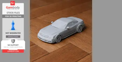 3D-printed model of a Cadillac XLR car on a wooden surface.