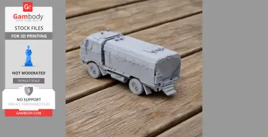 Gray 3D-printed model of a Burraq MRAP vehicle displayed on a wooden surface.