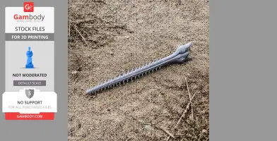 3D printed largetooth sawfish skull replica lying on sandy ground.